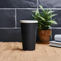 .Black glass on empty table mockup. photo