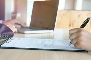 Man Completing Application Form during job interview. human resources concept. photo