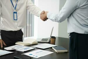 Businessman shaking hands successful making a deal. mans handshake. Business partnership meeting photo