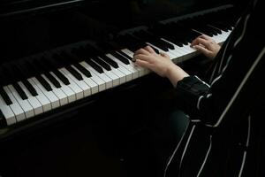 Beautiful woman playing piano, learn to play piano. photo