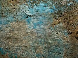 Texture of an old concrete wall, painted over with strokes of blue and light brown paint for a background in a loft style, for your design. Photo. photo