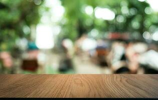 Wood Table Top in Blur Background room interior with empty copy space. photo