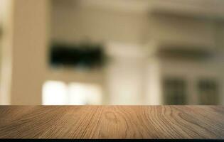 Wood Table Top in Blur Background room interior with empty copy space. photo