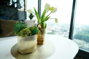 Home interior decor dried flowers in glass vase in Living room decoration. rustic brown wooden table restaurant cafe interior photo