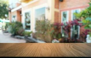 Empty dark wooden table in front of abstract blurred bokeh background of restaurant . can be used for display or montage your products.Mock up for space. photo