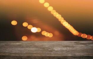 Empty dark wooden table in front of abstract blurred bokeh background of restaurant . can be used for display or montage your products.Mock up for space. photo