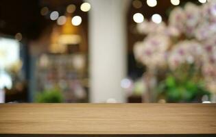 Empty wooden table in front of abstract blurred background of coffee shop . can be used for display or montage your products.Mock up for display of product photo