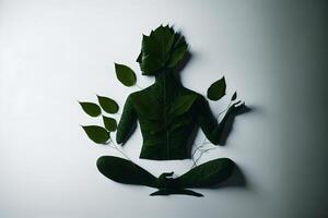 produced with technology. Man leaf-shaded silhouette in lotus position, contemplating. Mindfulness, photo