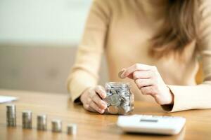 Female hand stack coins growing business. Saving money financial or loan for prepare in future financial insurance photo