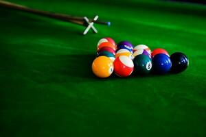 Billiard balls. Colorful snooker balls on green frieze. photo