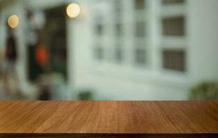 Empty wood table top and blur of out door garden background Empty wooden table space for text marketing promotion. blank wood table copy space for background photo