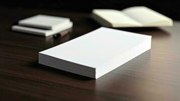 Blank business card for mockup. white textured paper background on table photo