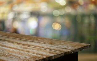 Wood Table Top in Blur Background room interior with empty copy space. photo