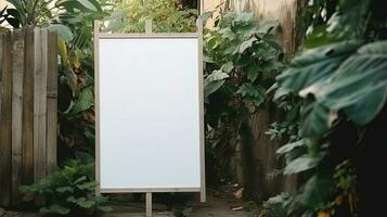 Empty white banner with mock up space white of signboard on plants wall space for text photo