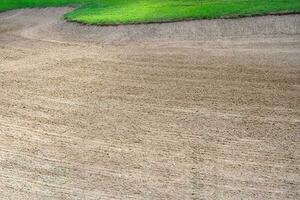 Golf course sand pit bunker aesthetic background,Used as obstacles for golf competitions for difficulty and falling off the course for beauty. photo