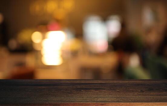 Empty wooden table in front of abstract blurred background of coffee shop . can be used for display or montage your products.Mock up for display of product photo