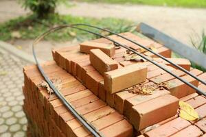 Pallet a red brick building material stack of new red bricks for construction. photo