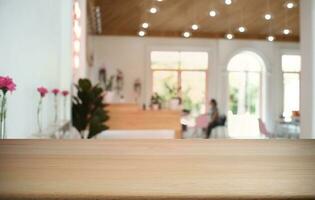 Empty dark wooden table in front of abstract blurred bokeh background of restaurant . can be used for display or montage your products.Mock up for space. photo