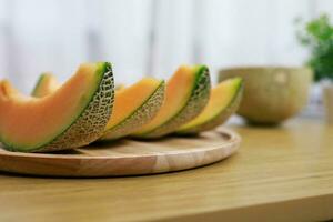 Fruits for healthcare Green Melon wooden table honey melon or cantaloupe photo