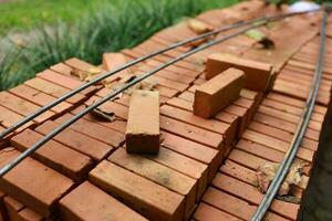 Pallet a red brick building material stack of new red bricks for construction. photo