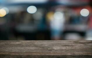 Wood Table Top in Blur Background room interior with empty copy space. photo