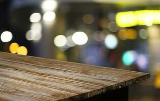 Wood Table Top in Blur Background room interior with empty copy space. photo