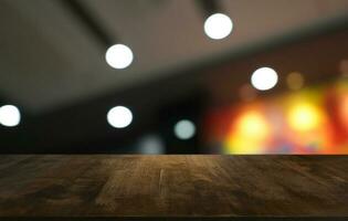 Empty wooden table in front of abstract blurred background of coffee shop . can be used for display or montage your products.Mock up for display of product photo