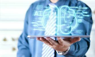 Businessman touching the brain working of Artificial Intelligence AI in the futuristic business and coding software development on interface and synchronize network connection, IoT, innovative. photo