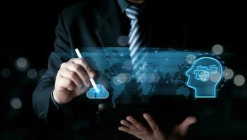 Businessman use a pen touching the cloud working of Artificial Intelligence AI in the futuristic business and coding software development on interface , IoT, innovative. photo