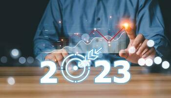 Business and Technology target set goals and achievement in 2023 new year resolution statistics graph rising revenue, 2023 Concept, 2023 New Year Goal Target, Action, Plan, Idea, Inspiration Concept. photo