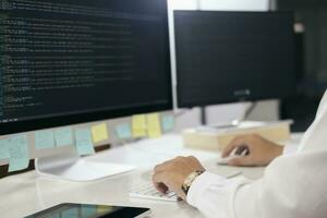 Programmer is coding and programming software photo