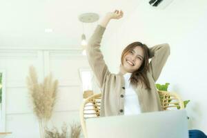 Carefree woman relaxing sitting on a sofa at home. photo