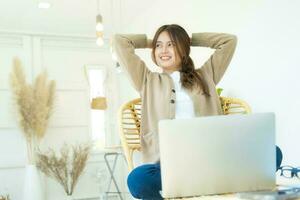 Carefree woman relaxing sitting on a sofa at home. photo