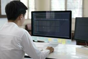 Programmer is coding and programming software photo