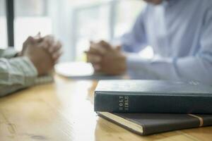 Two men praying for each other. photo