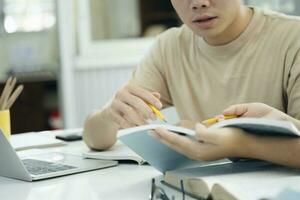 Young students campus helps friend catching up and learning. photo