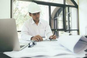 Architect or engineer working in office photo