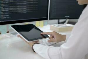 Programmer is coding and programming software photo