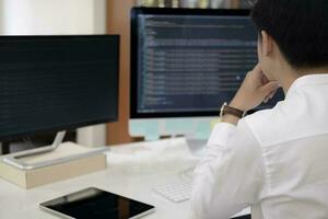 Programmer is coding and programming software photo