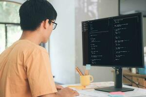 Programmers and developer teams are coding and developing software photo