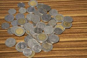 Stacking coins on the wooden table and growth graph to save money or investment to get business income by finance  marketing photo