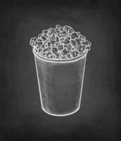 Popcorn in a plastic or paper cup. Chalk sketch on blackboard background. Hand drawn vector illustration. Retro style.