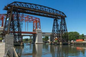 Ferry Bridge in the neighborhood of La Boca in the old port of Buenos Aires Argentina facing the Rio de la Plata and the Riachuello. photo