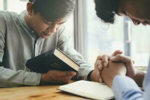 Two men praying for each other. photo