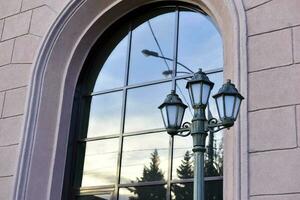 Square decorative street lights on a window background. Beautiful street lights in the city. photo