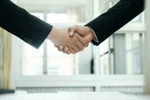 Businessmans handshake after good deal. photo