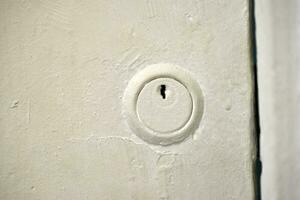 Keyhole close-up. The lock on the door. photo