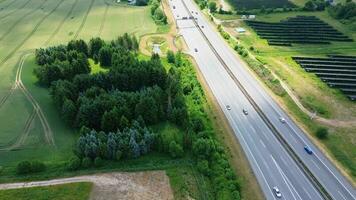 Aerial view of the A7 motorway in northern Germany with big solar panel areas close to the highway. photo