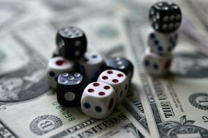 Dollar bills and dice. Financial games. Speculation. photo