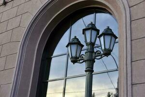 Square decorative street lights on a window background. Beautiful street lights in the city. photo